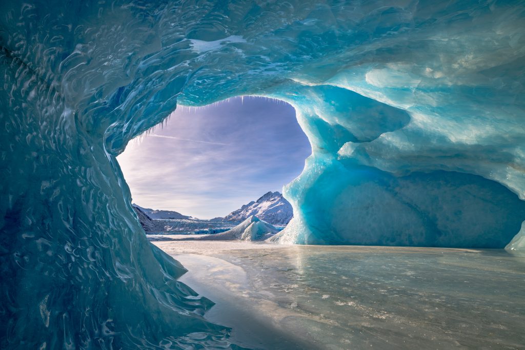 Frozen water and a glacial tunnel in Alaska Colony Glacier