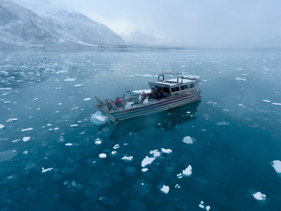 Landing craft gathers glacial ice in Prince William Sound