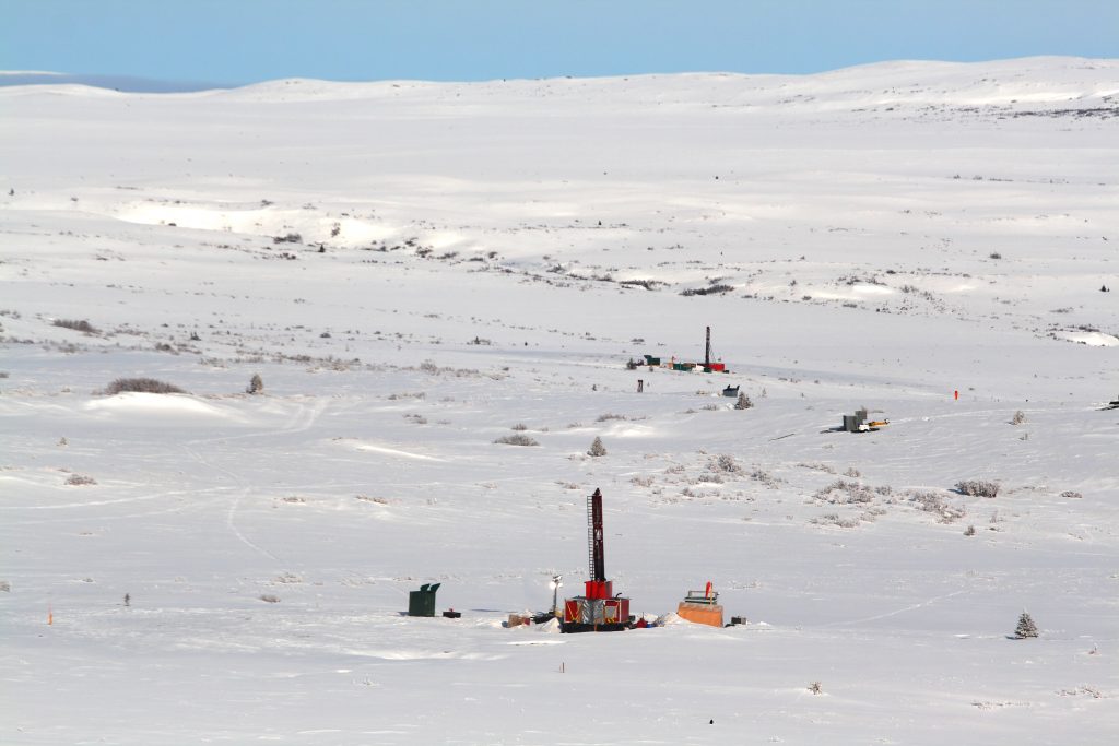 A winter landscape and several exploration drill rigs in the area of Alaska Pebble Mine