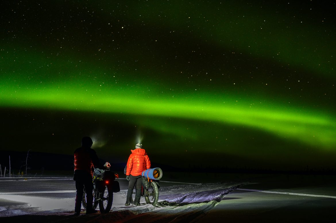 Iditarod Trail Invitational: A 1,000-mile odyssey Bikers watch green northern lights on a dark night