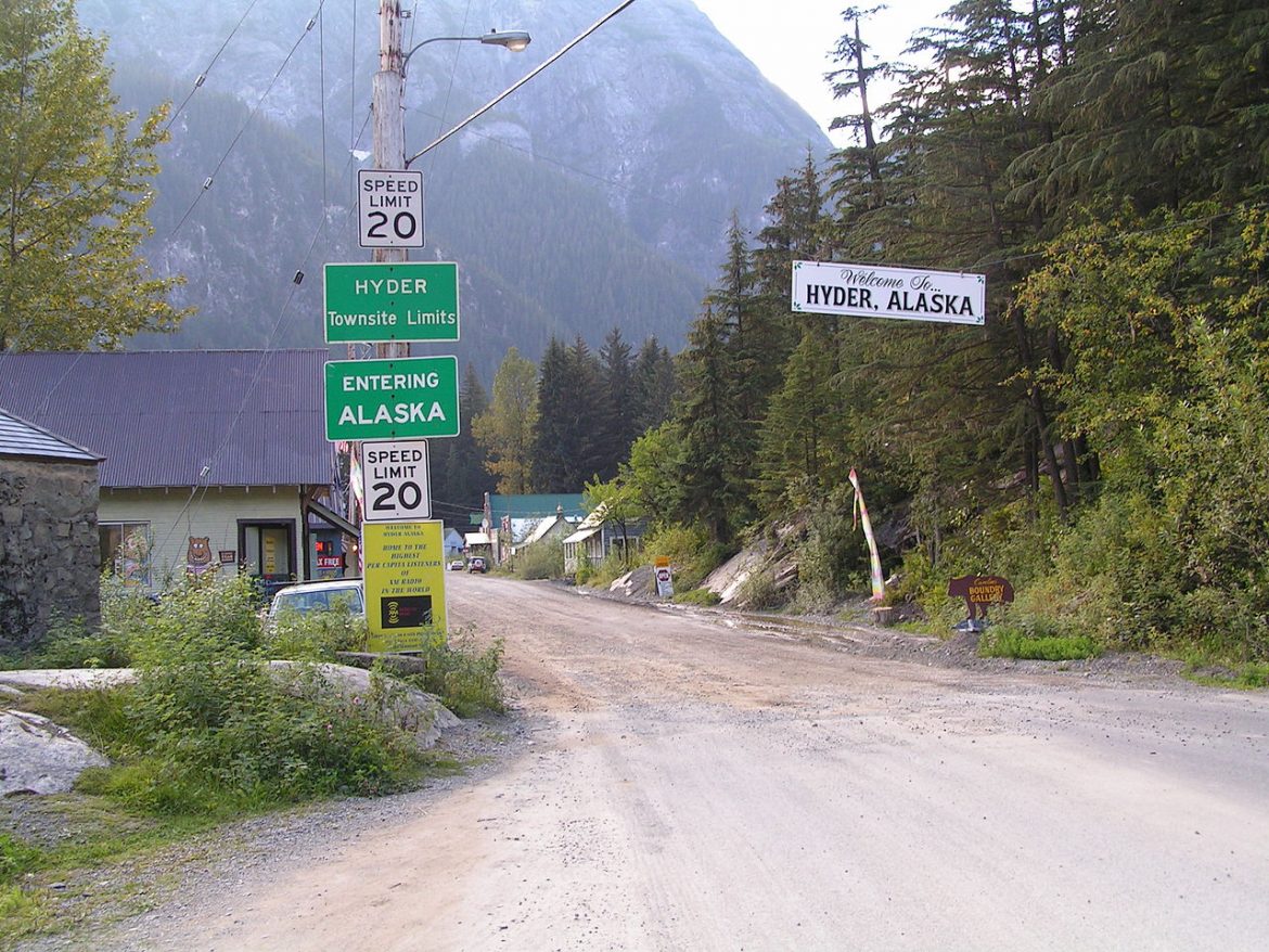 When the roads are open, visit Hyder, Alaska Road leading into Hyder, Alaska