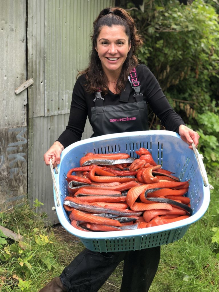Heather Douville holding a tub of filleted salmon