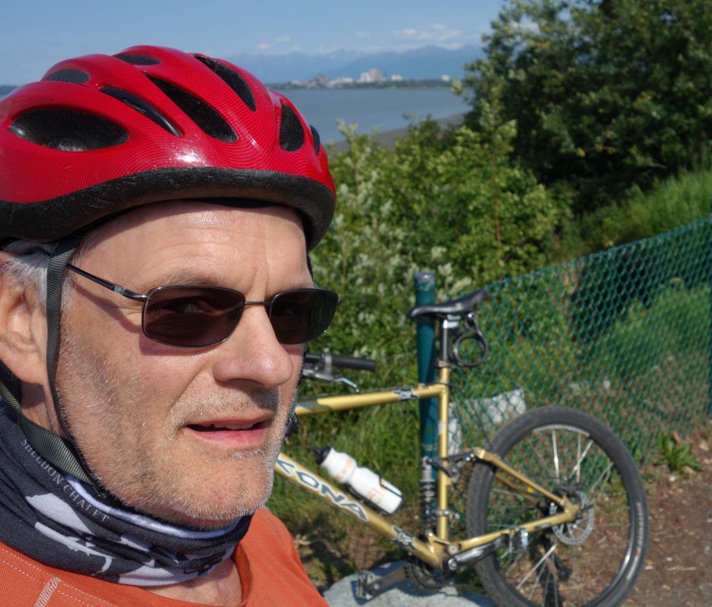 Scott McMurren wearing transitional lenses and biking