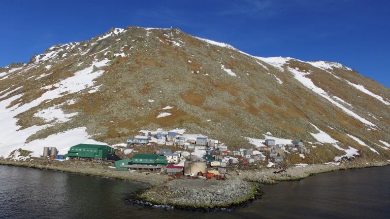 Buildings along the coast of Litle Diomede with very little snow