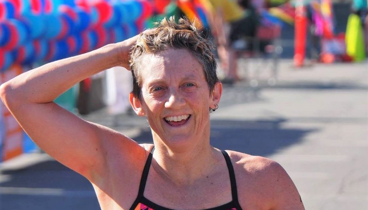 Keeping Pace with Lisa Keller Triathlete Lisa Keller smiling at the finish line of a race