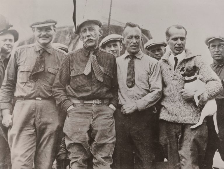 Amundsen and other men in ties posing for a black and white photo