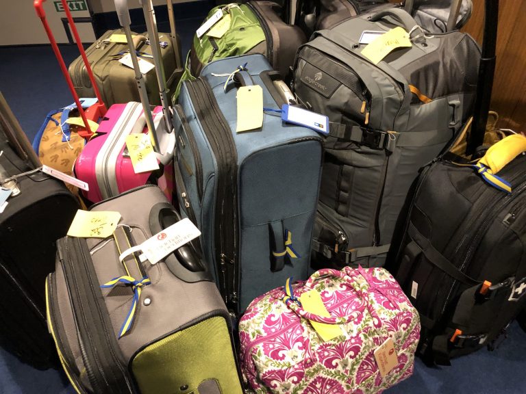 A stack of tagged luggage