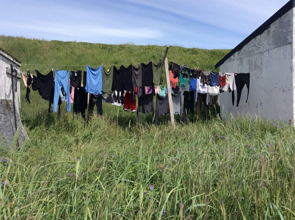 Clothes hang dry on a line