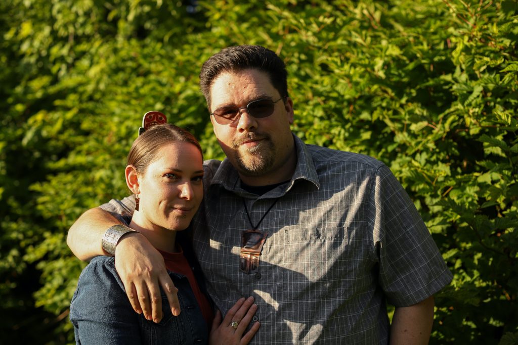 Tsimshian artist David R. Boxley with his arm around partner Kandi McGilton