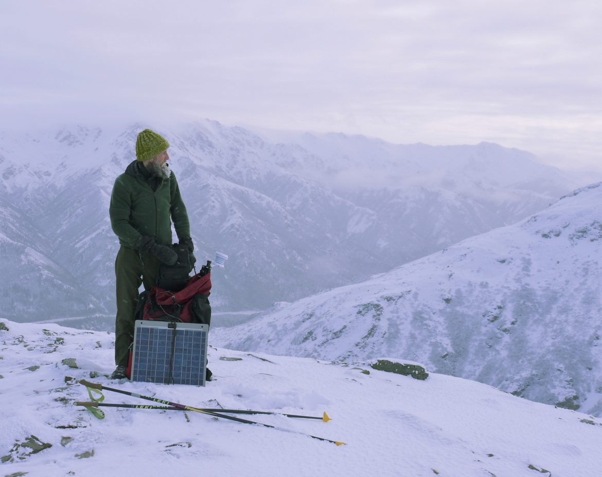 Davyd Betchkal on top of a snowy mountain in winter