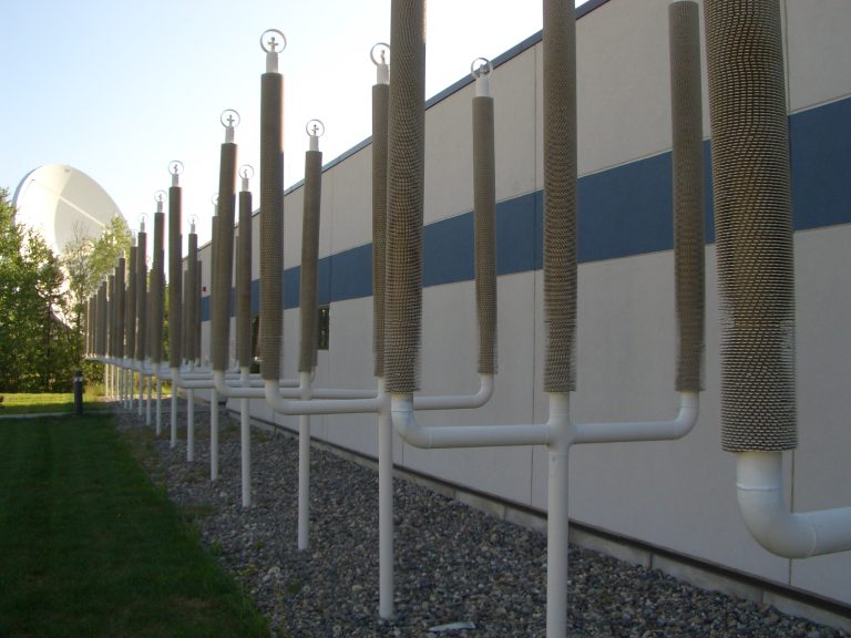 Thermosyphons like these that stabilize permafrost at the Fairbanks International Airport are also being used in arctic ice cellars.